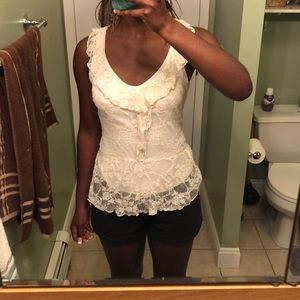A white/cream lace tank